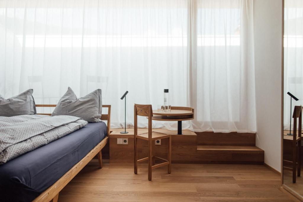 Postel nebo postele na pokoji v ubytování Haus am Turm