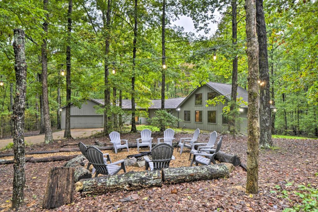 a group of chairs sitting in front of a house at Peaceful and Secluded Home with Private Fire Pit! in Rising Fawn