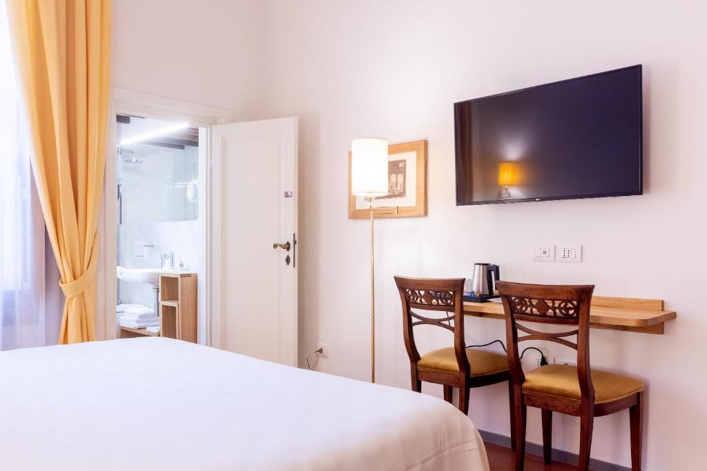 Posteľ alebo postele v izbe v ubytovaní La Casa del Ghiberti B&B