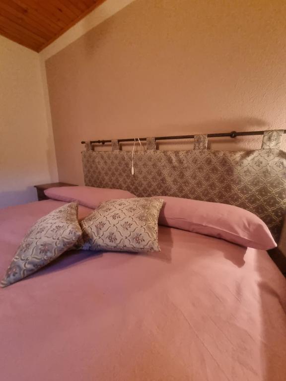 A bed or beds in a room at L'Atelier du Temps - HERBETET Appartement