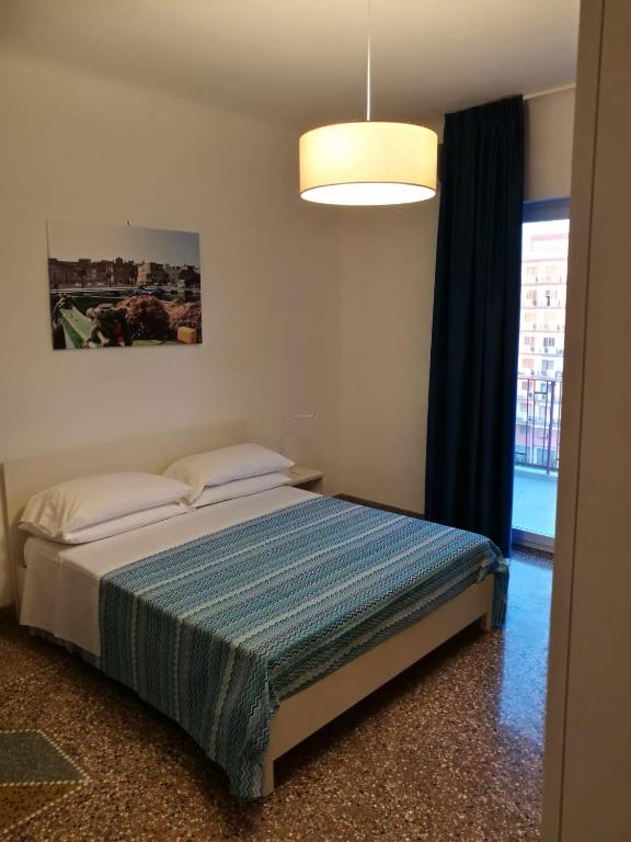 Postel nebo postele na pokoji v ubytování SETTIMO SOLE Affitta Camere