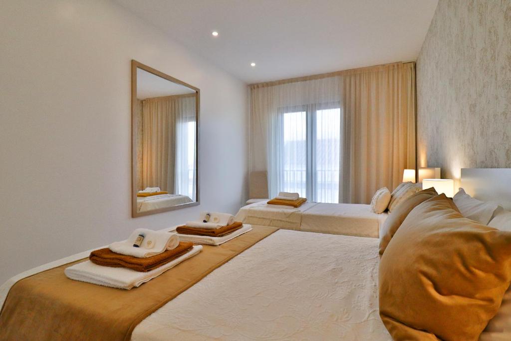 Uma cama ou camas num quarto em Janela Mar VIP
