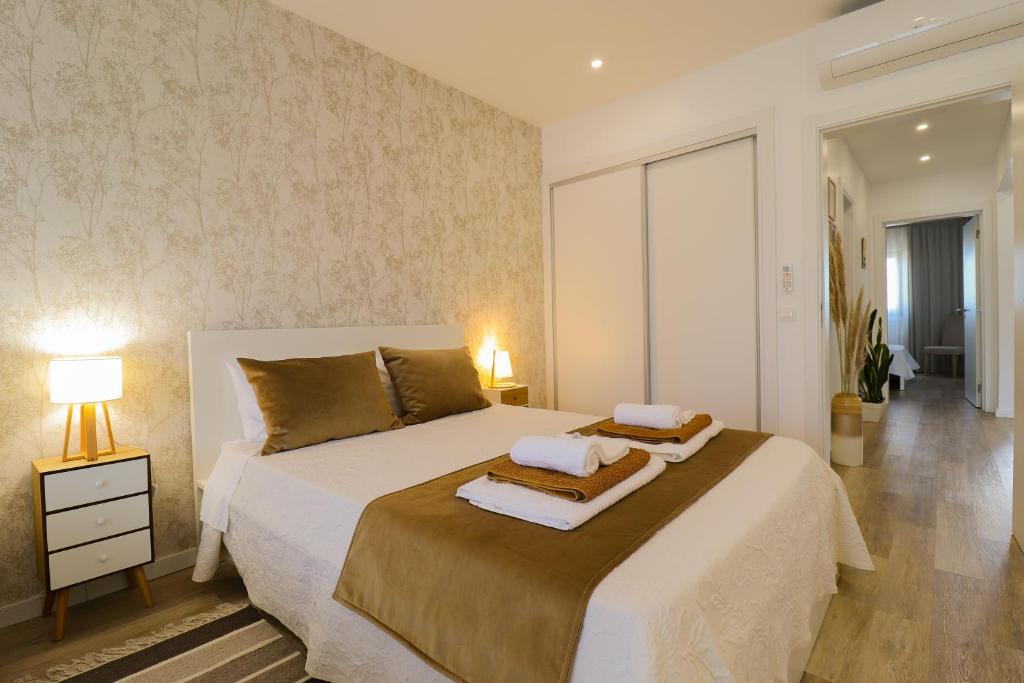 Uma cama ou camas num quarto em Janela Mar VIP