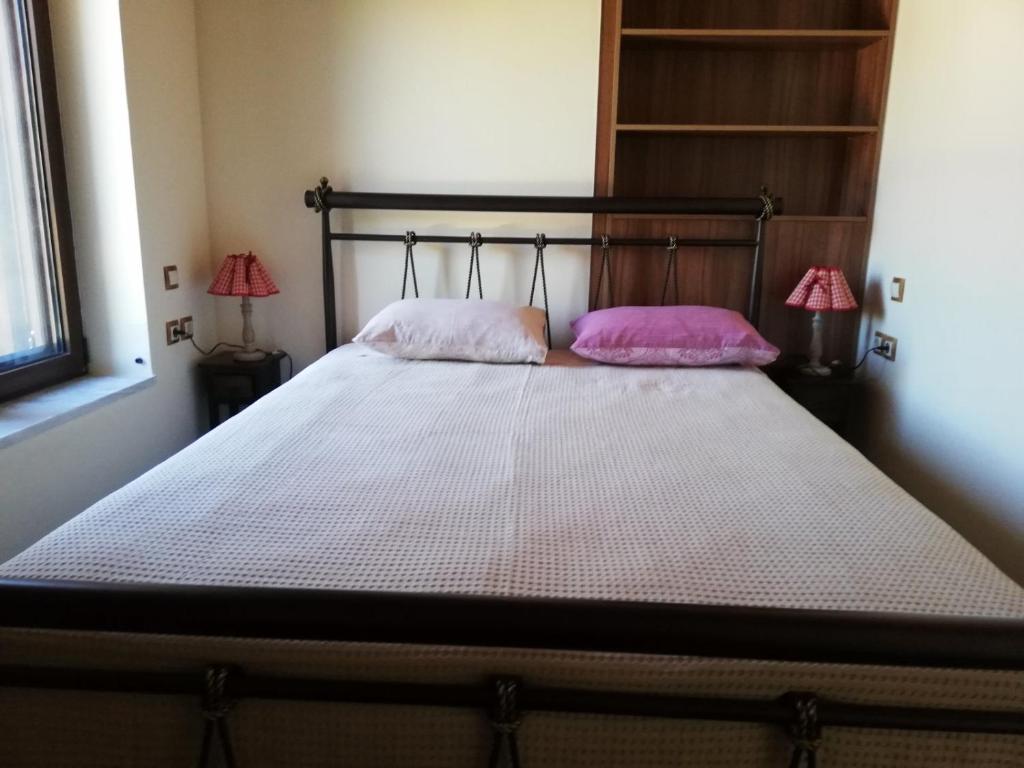 Postel nebo postele na pokoji v ubytování Giota's Gasthaus