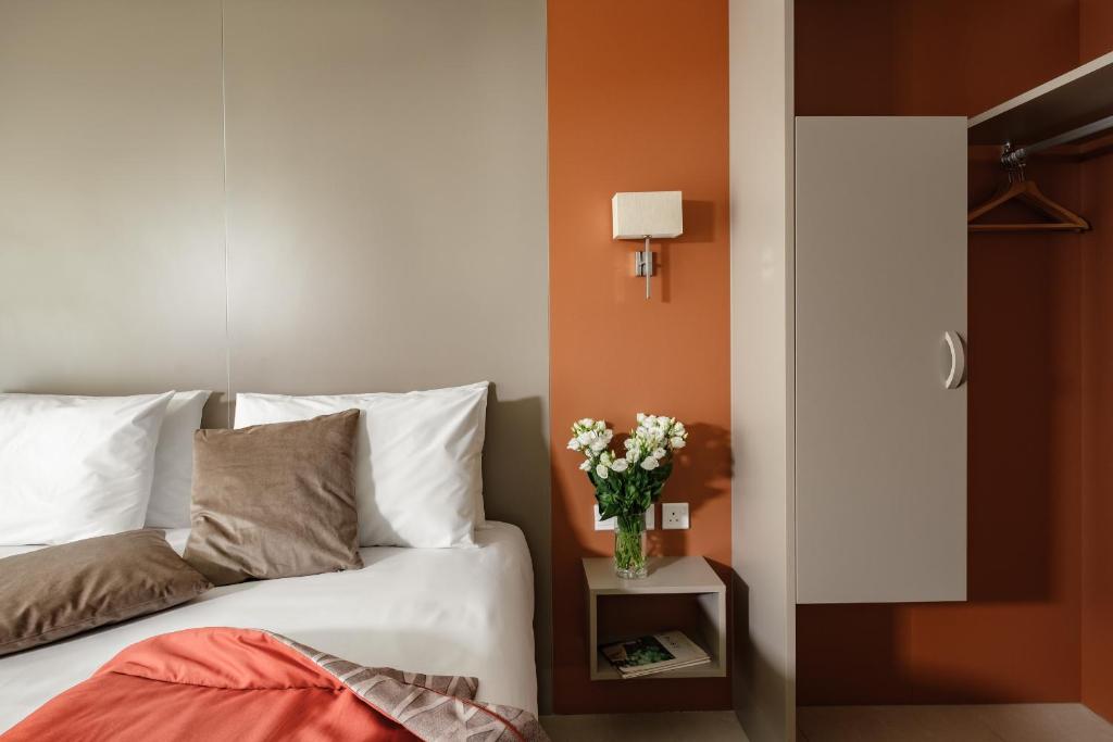 Postel nebo postele na pokoji v ubytování Mayflower Hotel Malta