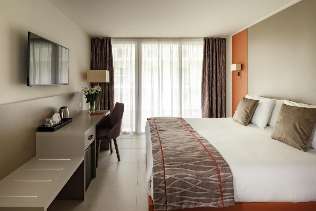 Postel nebo postele na pokoji v ubytování Mayflower Hotel Malta