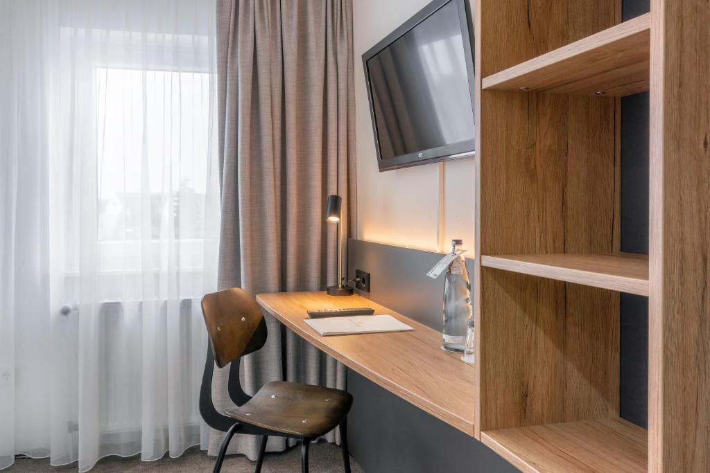 TV a/nebo společenská místnost v ubytování Hotel Bad Minden