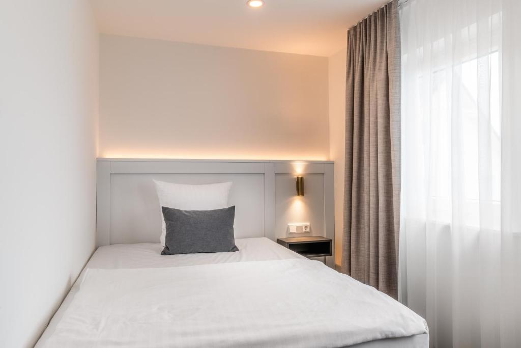Postel nebo postele na pokoji v ubytování Hotel Bad Minden