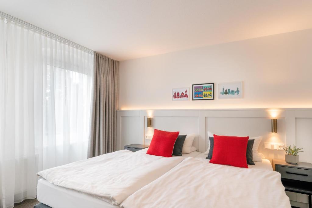 Postel nebo postele na pokoji v ubytování Hotel Bad Minden