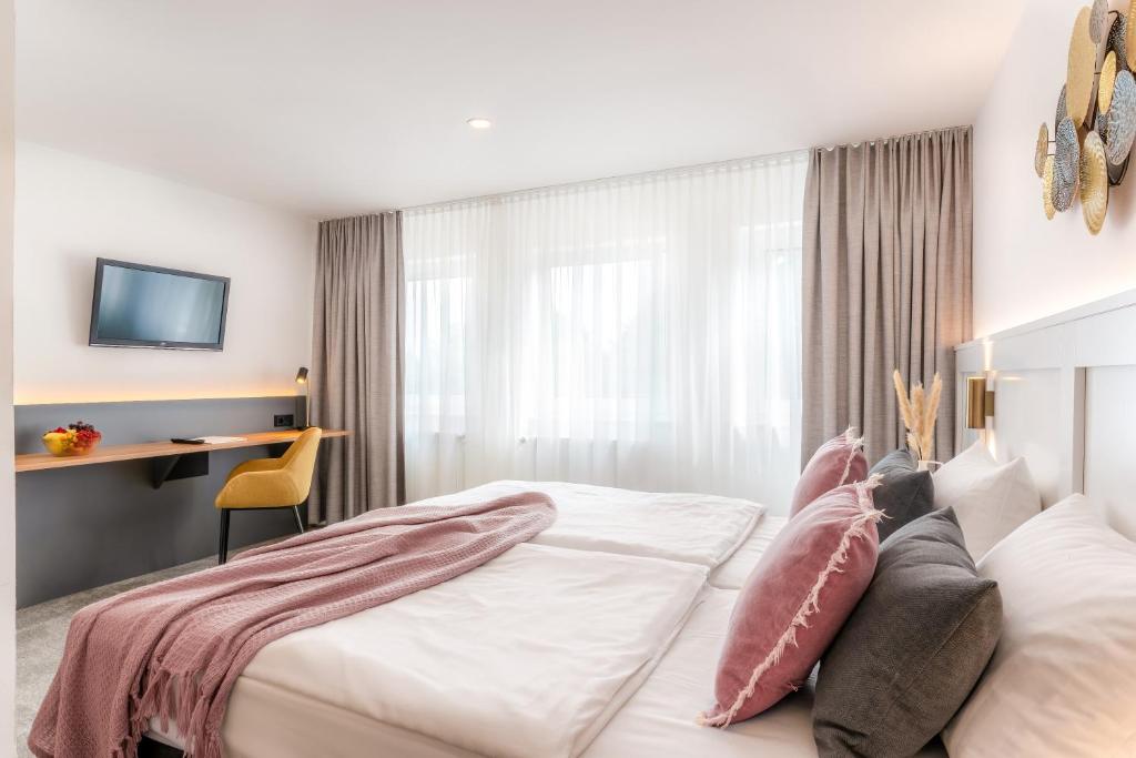 Postel nebo postele na pokoji v ubytování Hotel Bad Minden