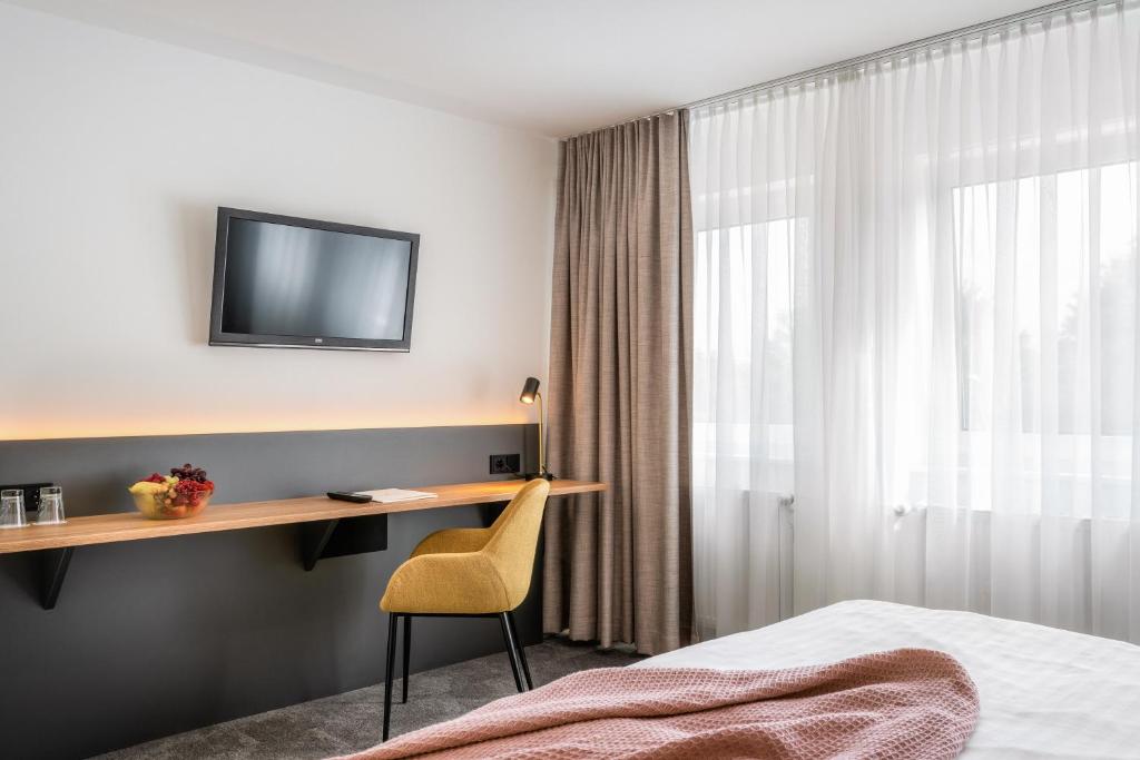 Postel nebo postele na pokoji v ubytování Hotel Bad Minden