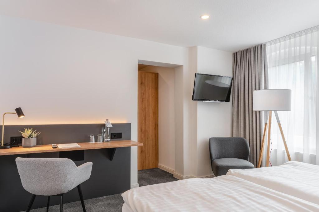 Postel nebo postele na pokoji v ubytování Hotel Bad Minden