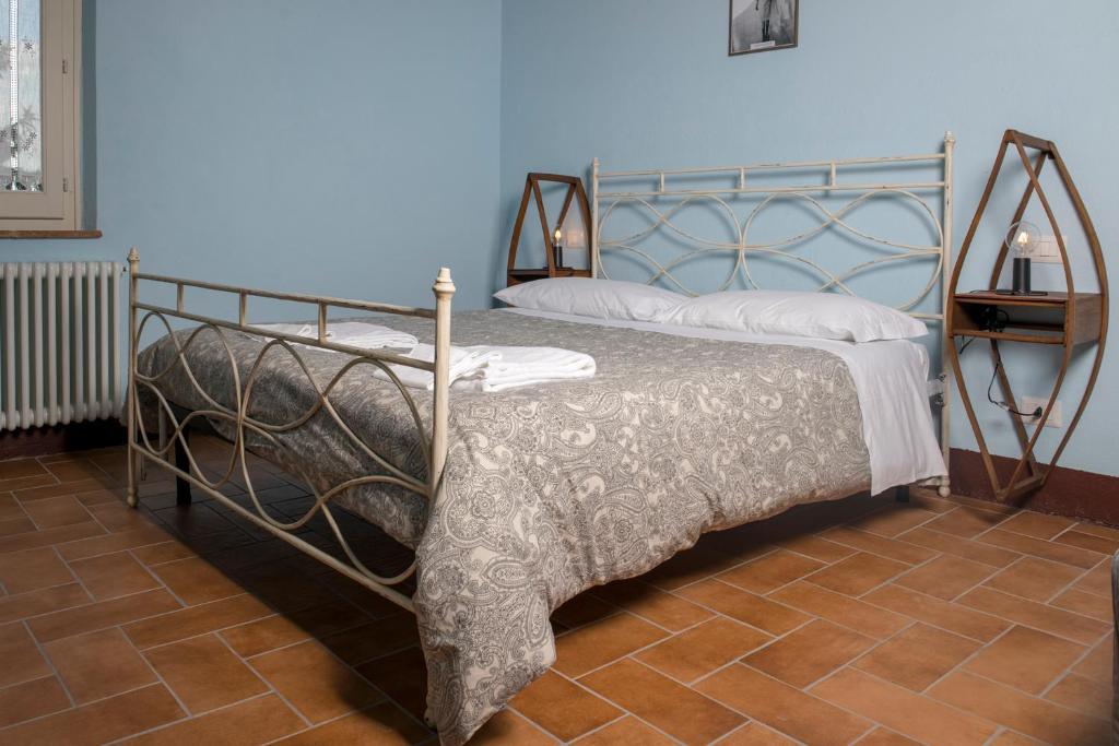 Postel nebo postele na pokoji v ubytování In Collegiata