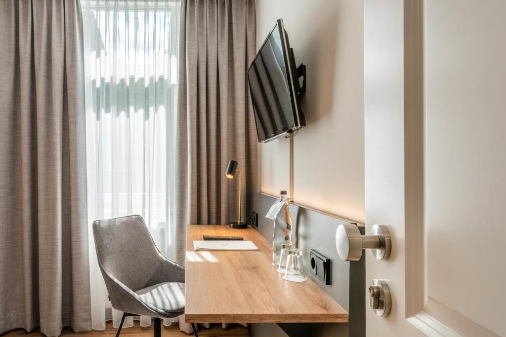 TV a/nebo společenská místnost v ubytování Hotel Bad Minden