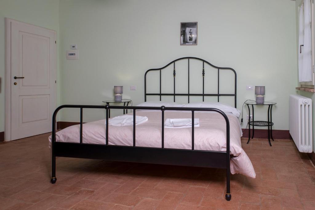 Postel nebo postele na pokoji v ubytování In Collegiata