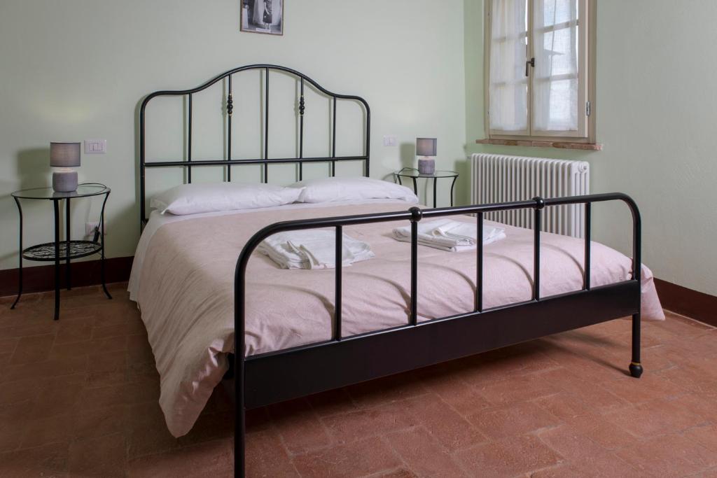 Postel nebo postele na pokoji v ubytování In Collegiata