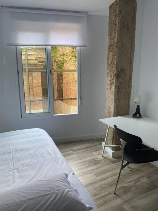 Postel nebo postele na pokoji v ubytování Cozy flat in La Petxina B