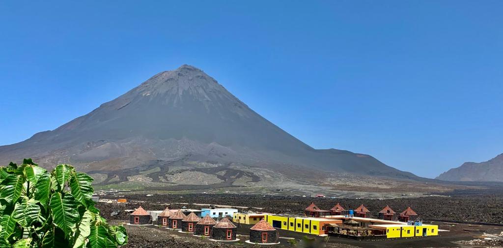 a mountain with a train in front of a town at Casa Marisa 2.0 in Portela