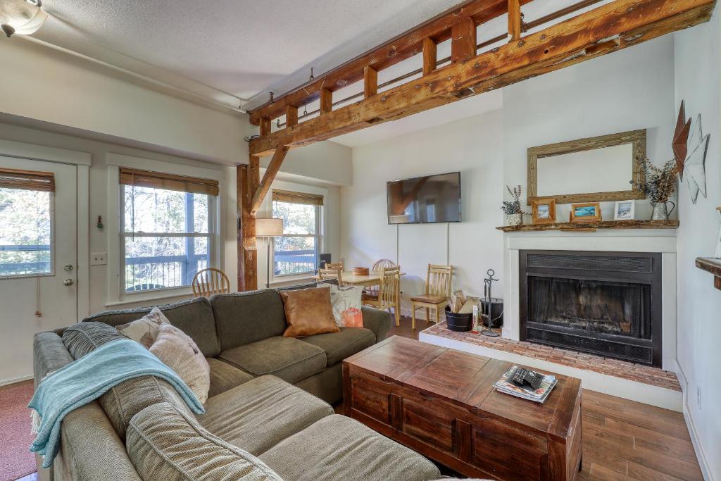 a living room with a couch and a fireplace at The Mill #210 in Ludlow
