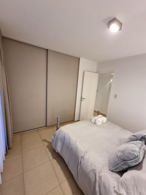 Postel nebo postele na pokoji v ubytování Nueva Córdoba - Premium