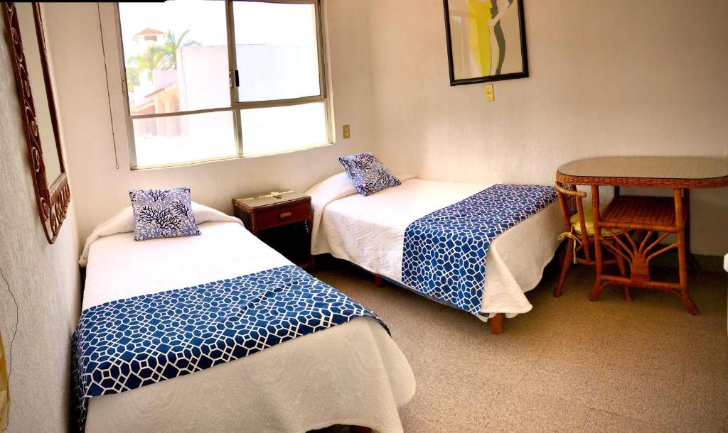 Postel nebo postele na pokoji v ubytování Casa Romantica De Playa