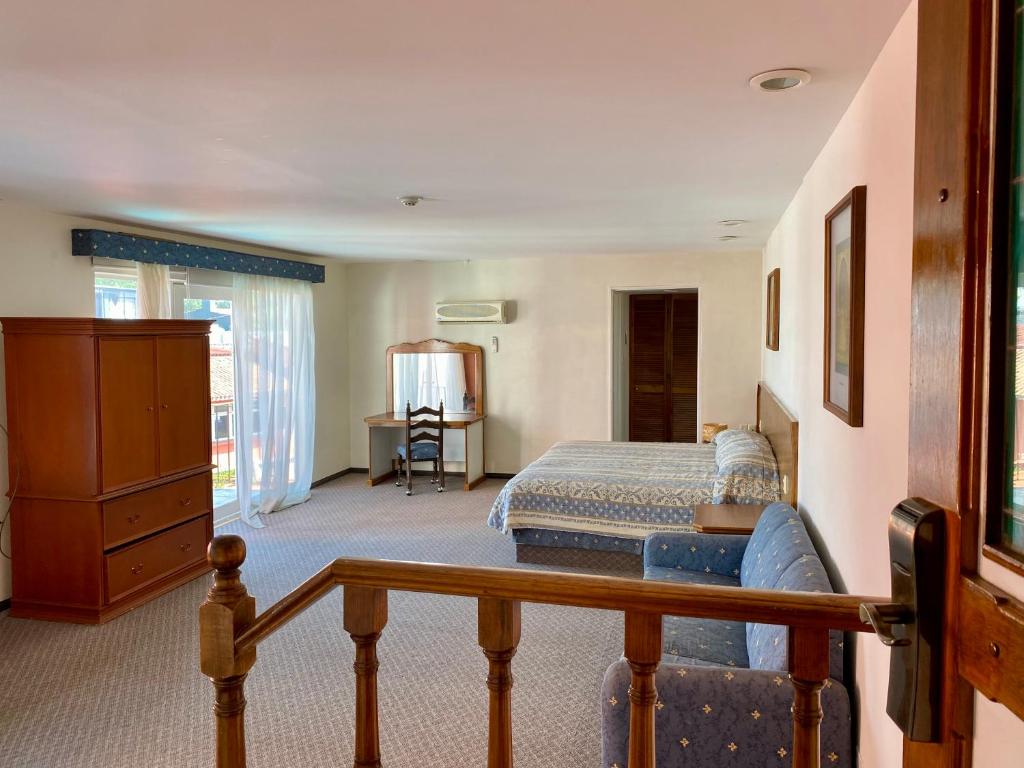 Postel nebo postele na pokoji v ubytování Hotel Posada Vista Bella