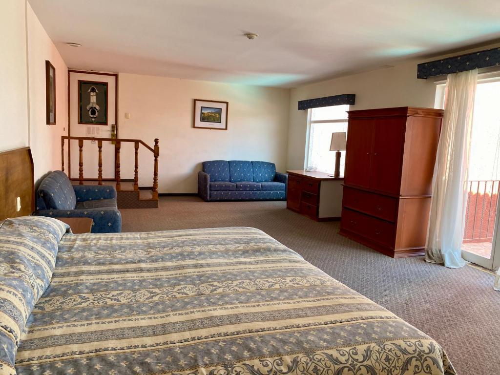 Postel nebo postele na pokoji v ubytování Hotel Posada Vista Bella