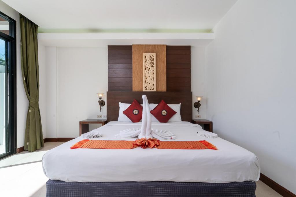 Кровать или кровати в номере Memory Karon Resort