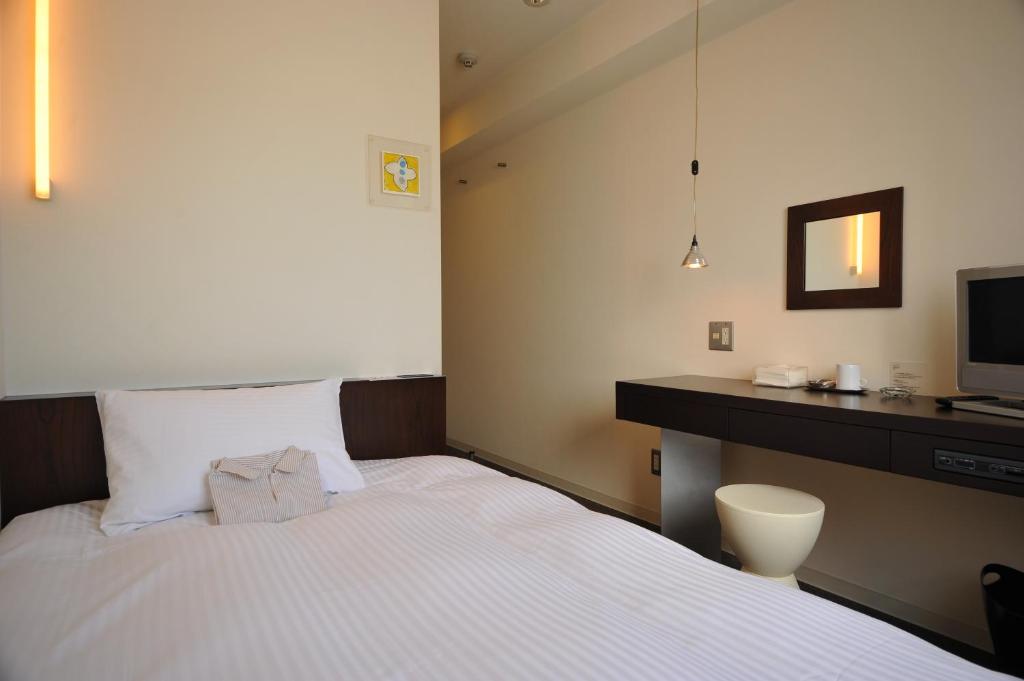 Postel nebo postele na pokoji v ubytování 7 Days Hotel Plus