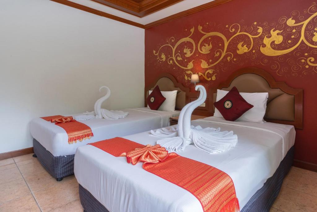 Кровать или кровати в номере Memory Karon Resort