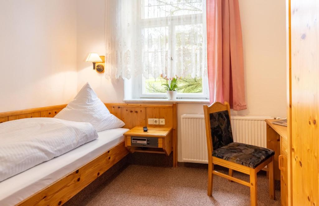 Postel nebo postele na pokoji v ubytování Hotel Carola
