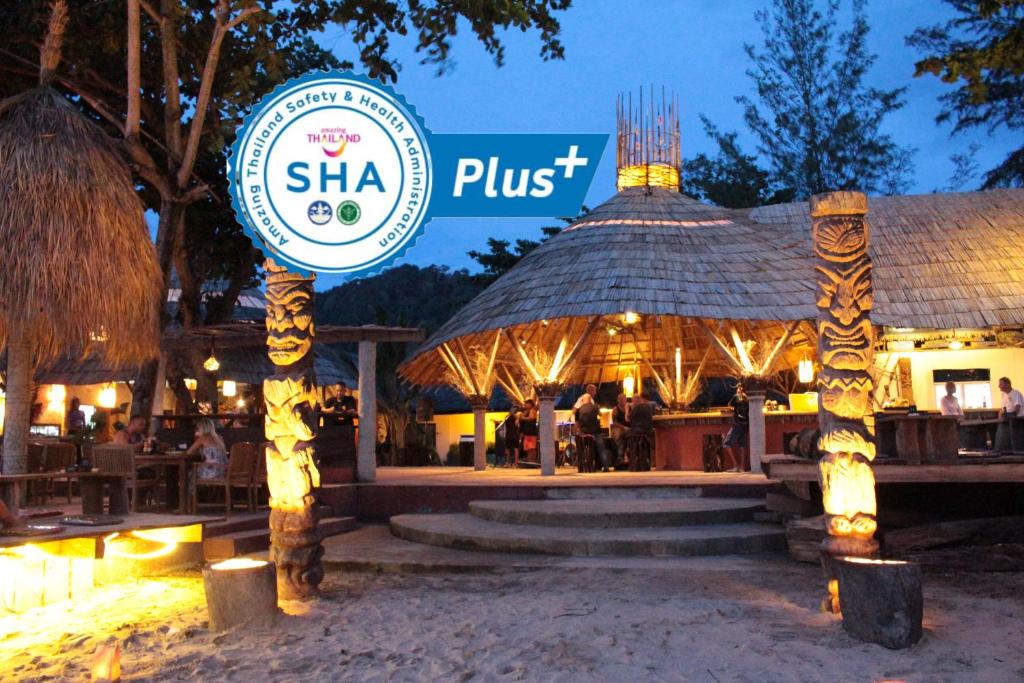 a restaurant with a sign that reads shka pust at Lanta Island Resort - SHA Extra Plus in Ko Lanta
