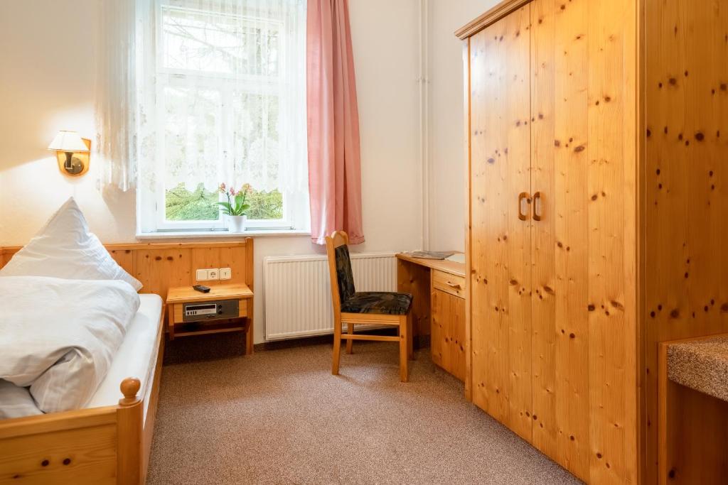 Postel nebo postele na pokoji v ubytování Hotel Carola