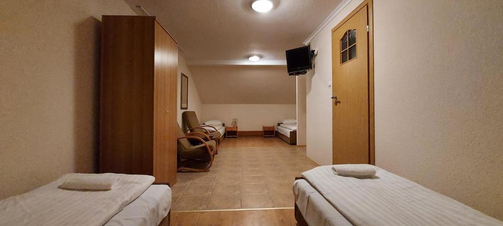 Posteľ alebo postele v izbe v ubytovaní Motel Panorama
