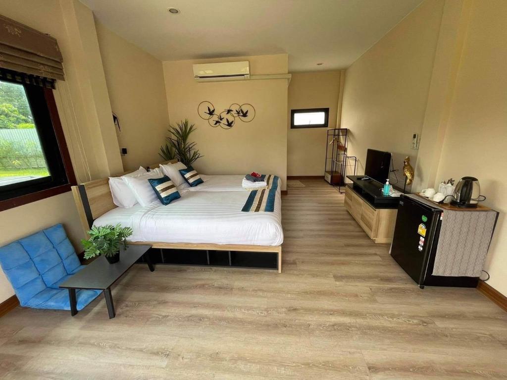 Postel nebo postele na pokoji v ubytování QG Resort
