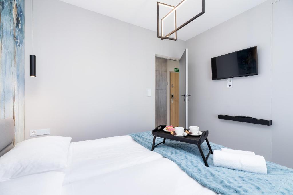 Posteľ alebo postele v izbe v ubytovaní Mogilska Apartments by Renters Prestige