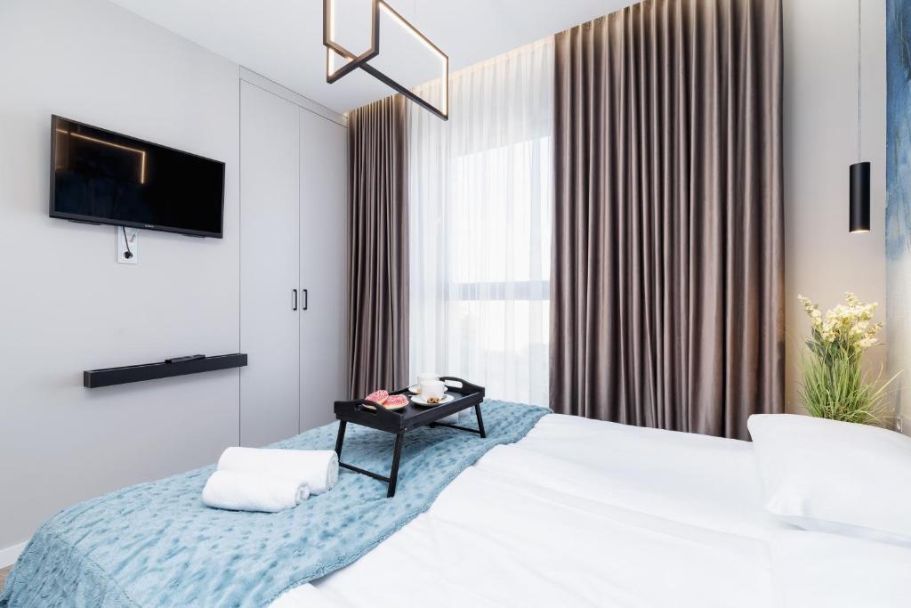 Posteľ alebo postele v izbe v ubytovaní Mogilska Apartments by Renters Prestige