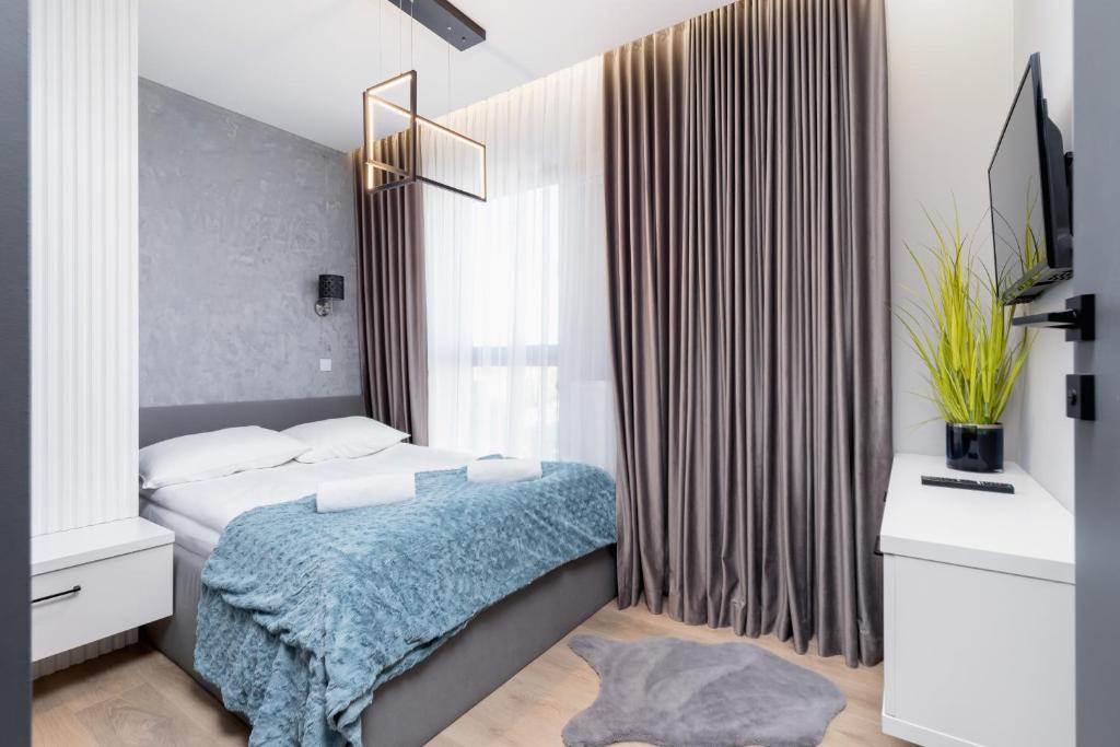 Posteľ alebo postele v izbe v ubytovaní Mogilska Apartments by Renters Prestige