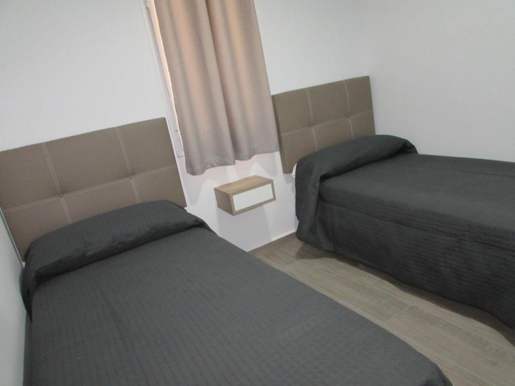 Posteľ alebo postele v izbe v ubytovaní MOJACAR SUN 365
