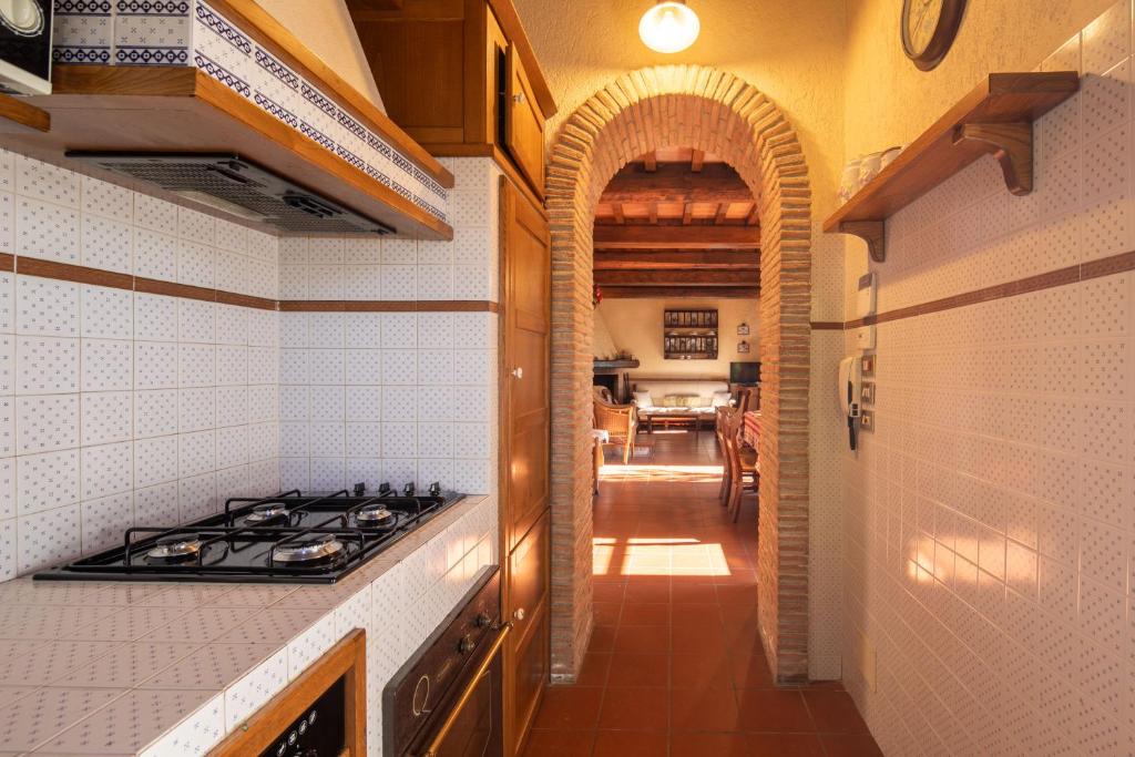 A kitchen or kitchenette at Casale Quadrifoglio by Mmega