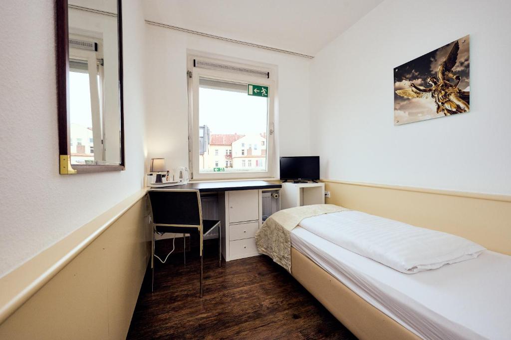 Postel nebo postele na pokoji v ubytování THE 4YOU Hostel & Hotel Munich