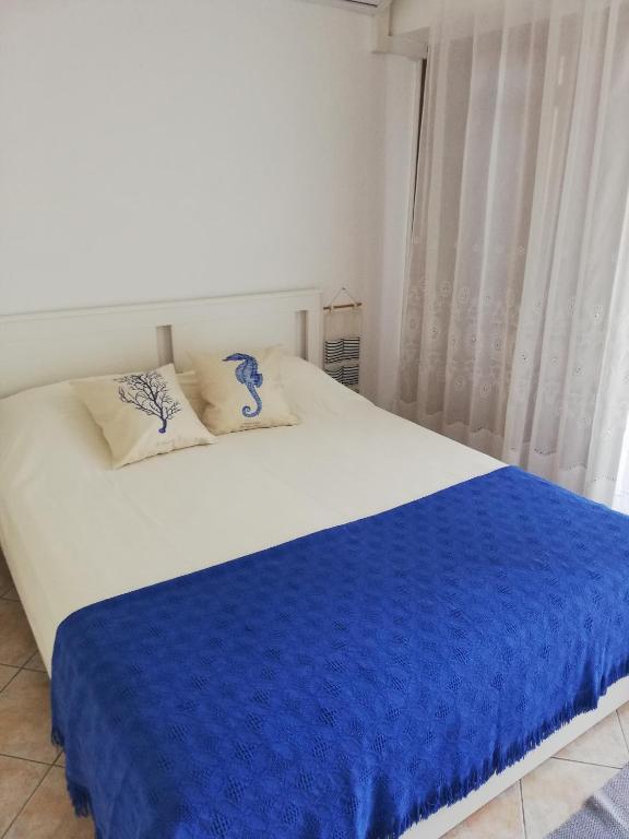 Postel nebo postele na pokoji v ubytování Apartmani Matiša
