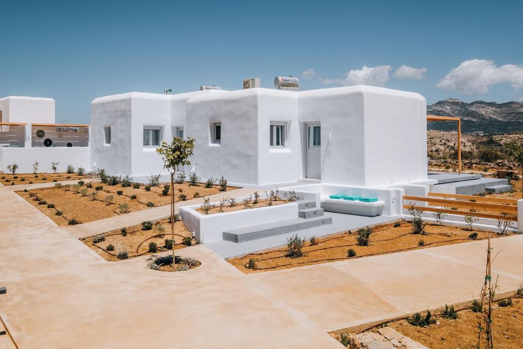 a rendering of a white house with a courtyard at Xerolithos Natural Living in Naxos Chora