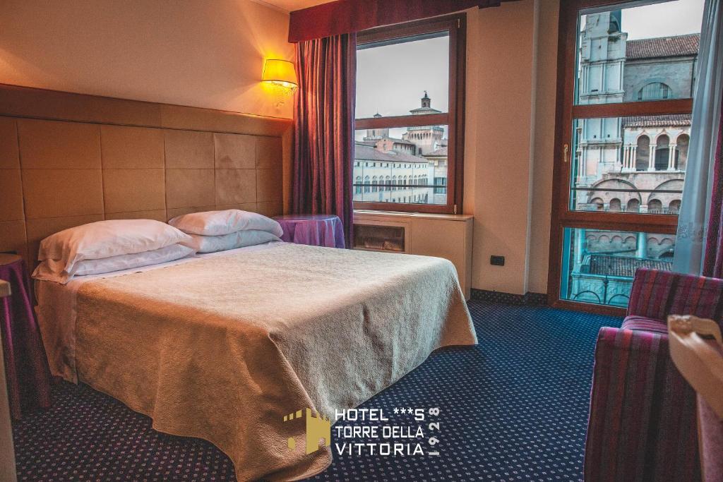 Postel nebo postele na pokoji v ubytování Hotel Torre della Vittoria 1928