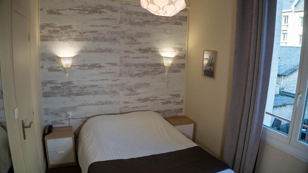 Postel nebo postele na pokoji v ubytování Hotel De l'Univers
