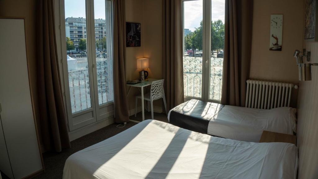 Postel nebo postele na pokoji v ubytování Hotel De l'Univers