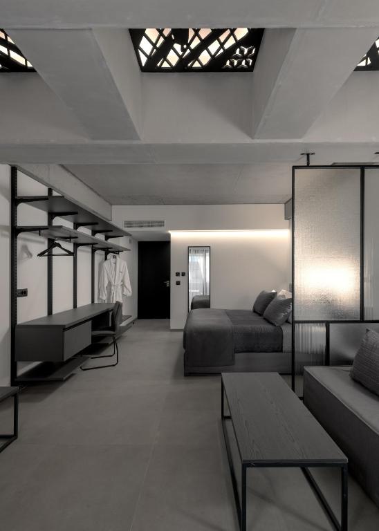 Postel nebo postele na pokoji v ubytování Essence Suites Downtown Suites - Adults Only
