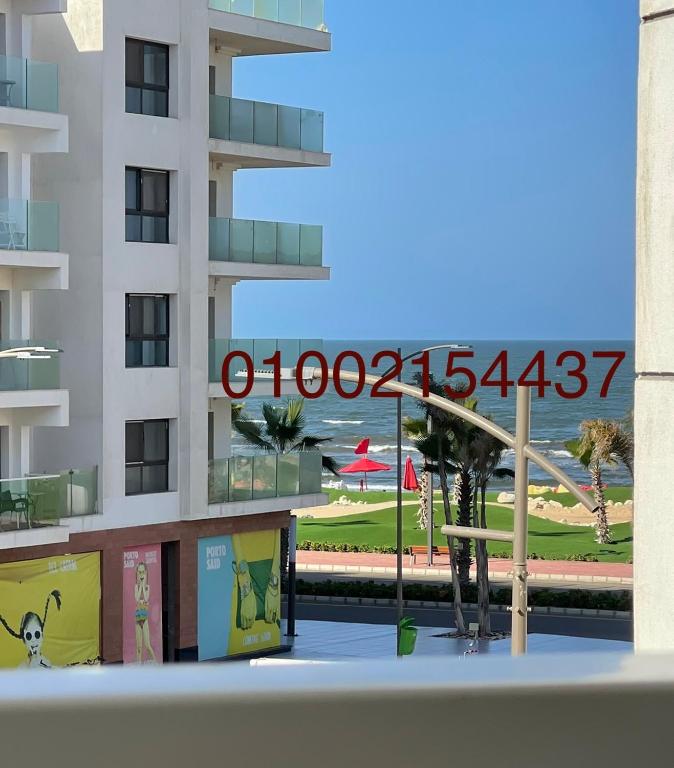 a view of a building with a sign on it at شقة غرفتين وصاله- بورتوسعيد Porto Said Resort in Port Said