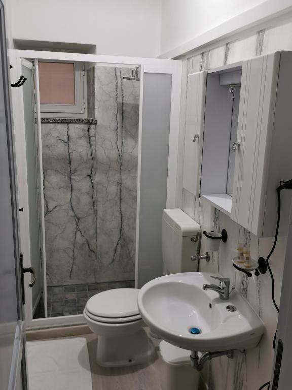 a bathroom with a toilet and a sink and a shower at Lo Nardo Accommodation in Lipari