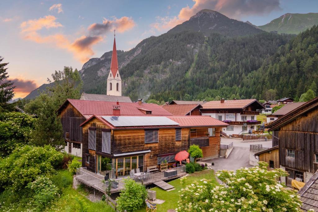 a small village with a church with a steeple at Ferienwohnung Heidi in Elmen